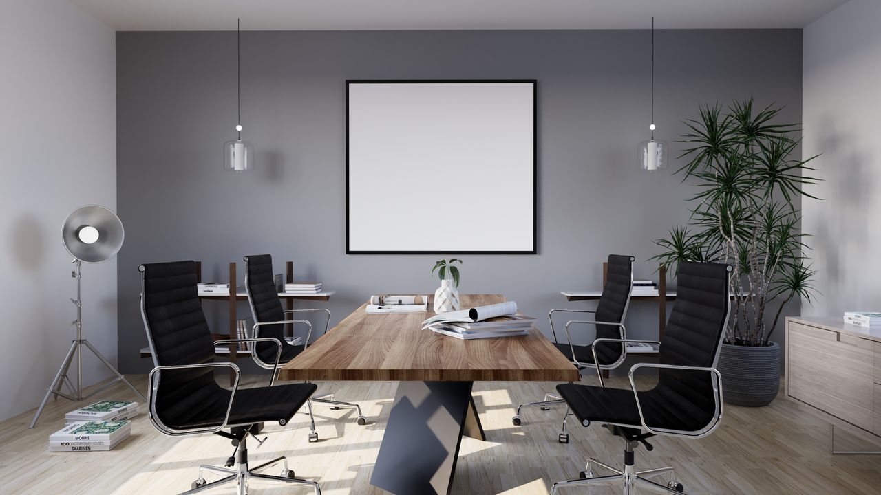 Sleek and modern conference room with minimalist design featuring stylish furniture and indoor plants.